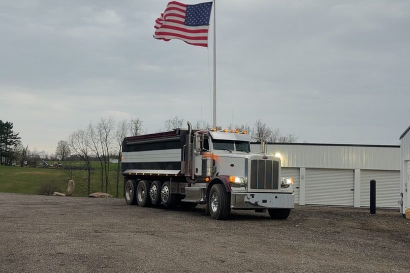 Galbraith quad-axle dump truck flying the flag