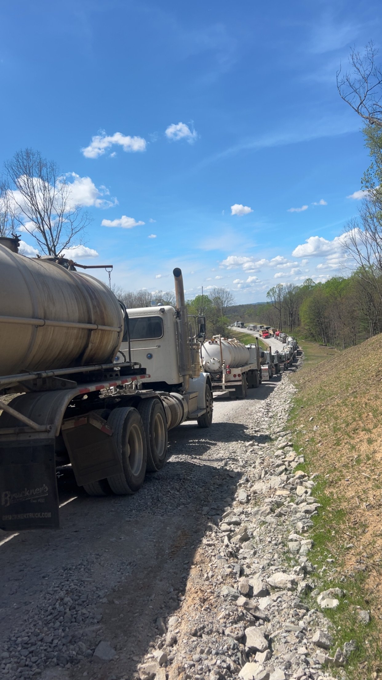 Tanker convoy lined up on a lease road
